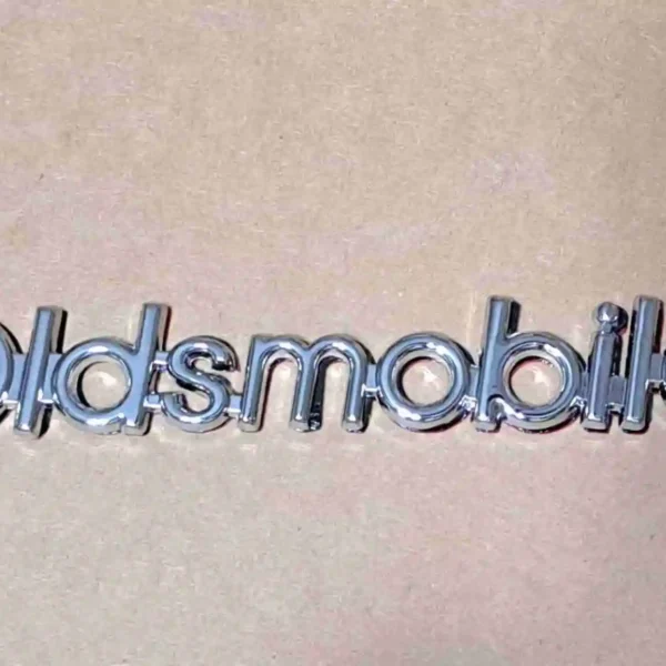 1986-1988 Cutlass header panel Oldsmobile emblem