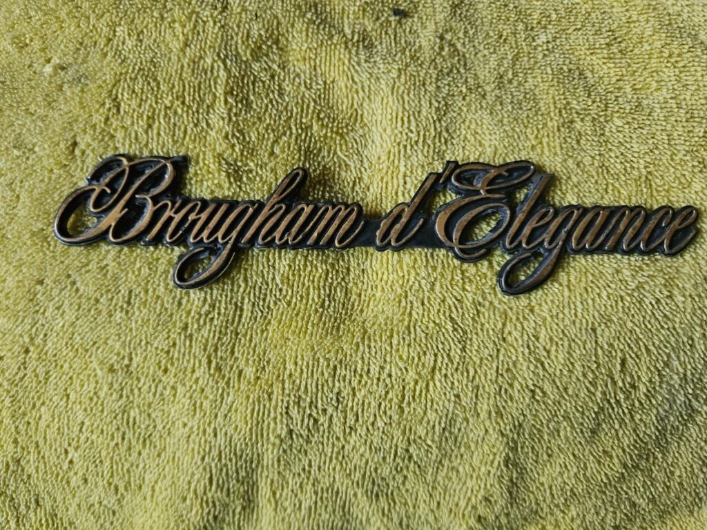 90-92 Cadillac Fleetwood Brougham D'Elegance Quarter Panel Emblem Name Plate