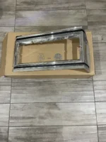 NOS GM Oldsmobile Delta 88 headlight marker trim bezel left