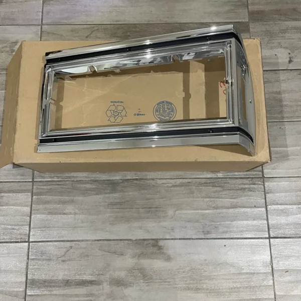 NOS GM Oldsmobile Delta 88 headlight marker trim bezel left