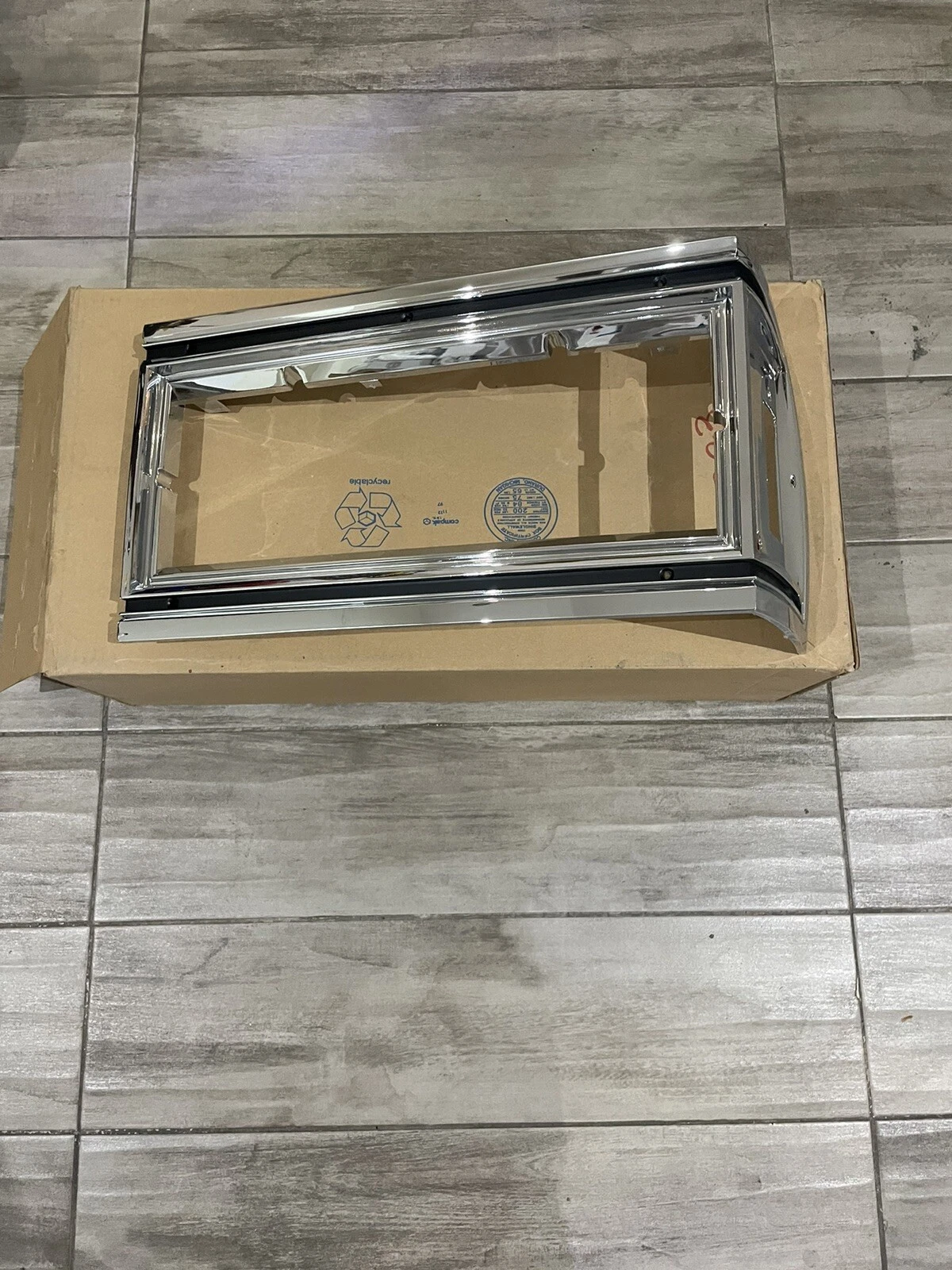NOS GM Oldsmobile Delta 88 headlight marker trim bezel left