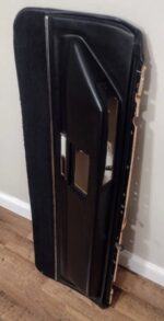 1970 Cadillac black lower door trim pad armrest panel passenger side